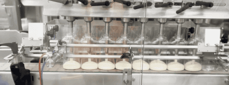 Peristalic liquid filling machine for the food industry